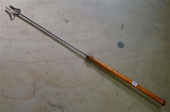 Long poker, with brass handle
